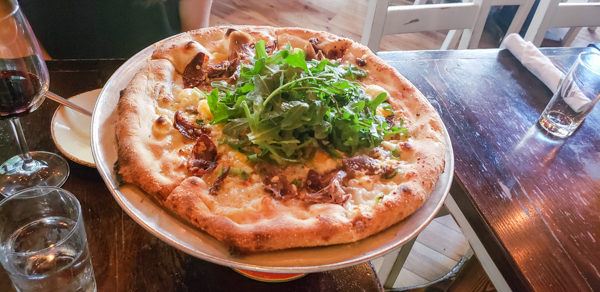 Sienna Mercato signature dishes Gourmet Meatballs (Emporio)Wood-Fired Pizza (Mezzo)Ricotta Doughnut Balls (Il Tetto)